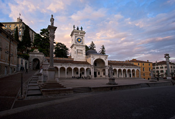 Fototapeta na wymiar Piazza Libertà in Udine with the Loggia of San Giovanni and column of justice at sunset. Italy.