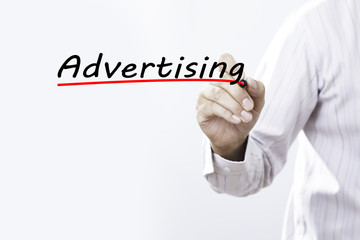 Businessman hand writing advertising with red marker on transpar