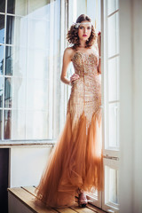 Fashion photo of beautiful girl wearing sparkling evening dress
