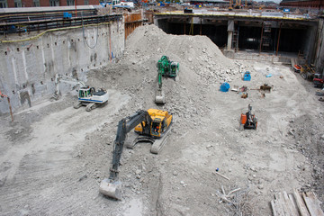 Excavators during the construction of an underground railway sta