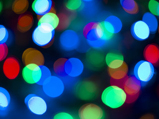 Colorful Christmas lights bokhe on black