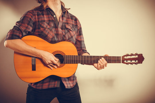 Male hands with guitar