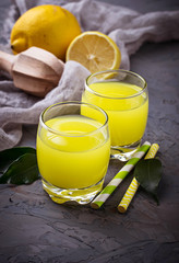 Fresh lemon juice on concrete background