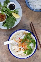 Pho ga- Vietnamese chicken noodle soup with crispy fried shallots and fresh herbs 