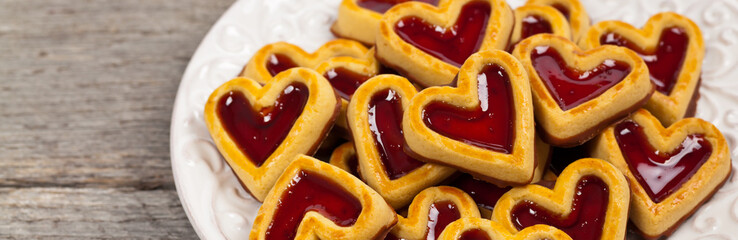 Cherry Hearts. Shortbread Cookies with Cherry Fruit Filling and Chocolate Base. Selective focus