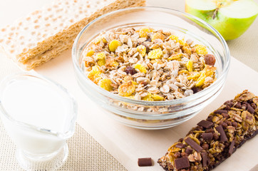 Muesli, milk and fresh apple for breakfast