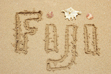 Word Fiji written on a beach