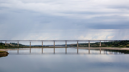 a long train bridge across a lake