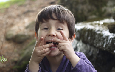 Fototapeta premium kid joking with stones