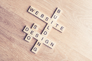 Conceptual media keywords on table with elements of game making 