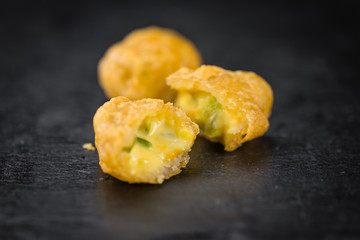 Cheese Nuggets (with Chilis) on a vintage slate slab (selective
