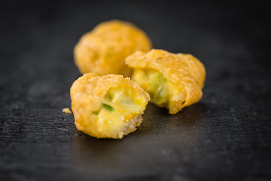 Cheese Nuggets (with Chilis) on a vintage slate slab (selective
