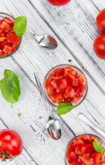 Cutted Tomatoes on vintage wooden background