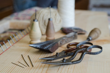 Fototapeta na wymiar Rug restoration, knitting tools