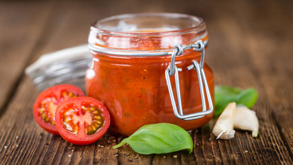 Tomato Sauce (selective focus) on vintage wooden background