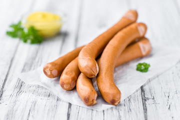 Sausages (Frankfurter) on vintage wooden background - obrazy, fototapety, plakaty