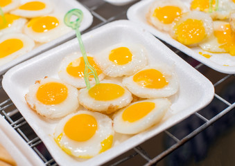 Thai street food made from small eggs put in plate foam.