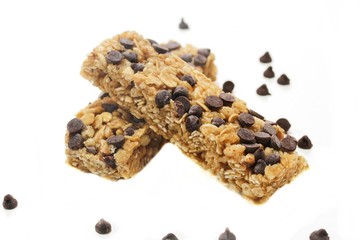 Chocolate chip granola bars isolated on white, selective focus