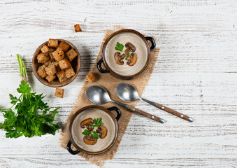 Two portions of mushroom cream soup, above view.
