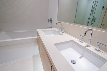 Fototapeta na wymiar Modern bathroom interior with bathtub and two sinks. 