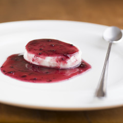 panna cotta with the seal of red berries