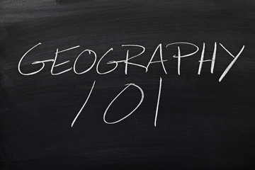 The words "Geography 101" on a blackboard in chalk