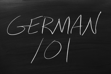 The words "German 101" on a blackboard in chalk