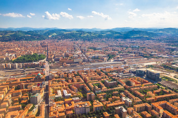 Cityscape of Bologna city, Italy, from aereal view. Famous landmarks: Central train station, the Two Towers, the Seven Churches. © bennymarty