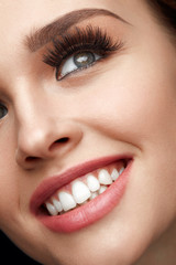Beauty Makeup. Closeup Beautiful Woman Face With Perfect Smile