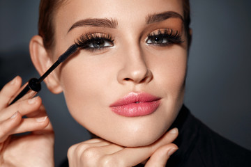 Woman With Beauty Makeup, Long Black Eyelashes Applying Mascara