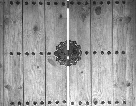 door knocker on wooden gray