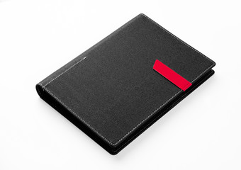  Black colored organizer book on white background.
