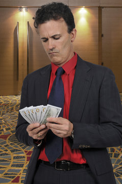 Man Holding 100 Dollar Bills
