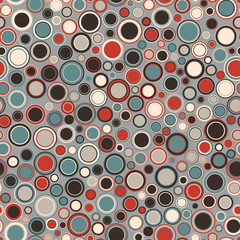 Seamless pattern. Consists of geometric elements having round shape and different color, located on a light background. Useful as design element for texture, pattern and artistic composition.