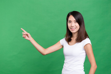 Young woman showing finger point up