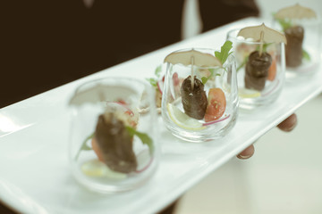 Waiter serving food in luxury dinner party, Blurry background wi