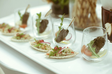 Food on white plate on the table for service in luxury dinner pa
