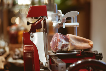 Meat slicer machine on the table in luxury dinner party, Blurry