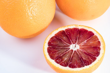 Blood oranges on a white background