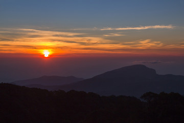 Landscape of sunrise over misty mountains in the morning at Chia