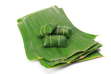 Banana leaves for wrapping or serving food as ecological dishware, isolated on white