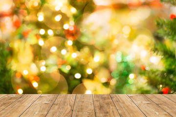 Naklejka na ściany i meble blur bokeh Christmas light background with wood floor