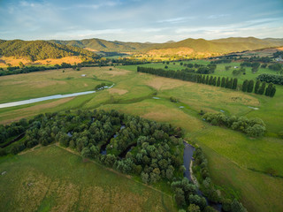 Aerial landscape of meadows and pastures of Mitta Mitta Valley near Eskdale, Victoria, Australia at sunset