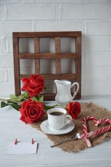 Valentines day breakfast with coffee, candy cane and flowers