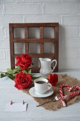 Valentines day breakfast with coffee, candy cane and flowers