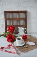 Valentines day breakfast with coffee, candy cane and flowers