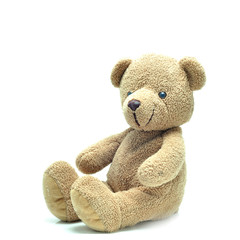 Brown teddy bear sitting on white background.