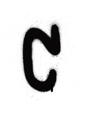 sprayed C font graffiti with leak in black over white