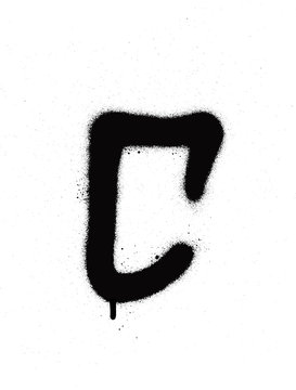 sprayed C font graffiti with leak in black over white