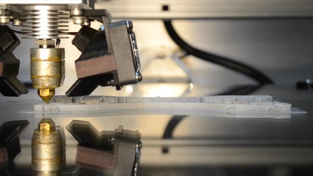 Working 3d printer, head of 3d-printer in action mirror reflective surface. 3D high tech digital printer computer machine in action